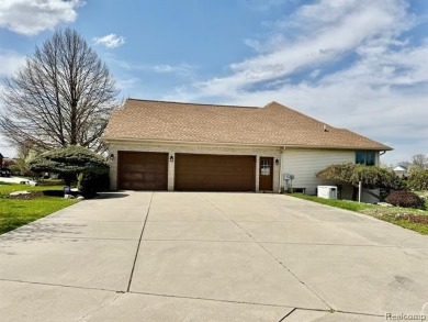 Greetings from this beautiful home at Woodridge Farms, adjacent on Copper Ridge Golf Club in Michigan - for sale on GolfHomes.com, golf home, golf lot