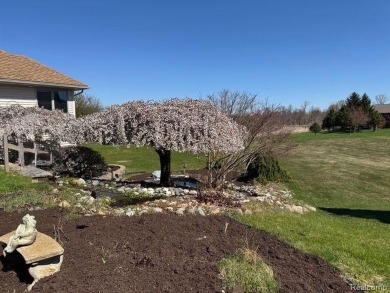 Greetings from this beautiful home at Woodridge Farms, adjacent on Copper Ridge Golf Club in Michigan - for sale on GolfHomes.com, golf home, golf lot