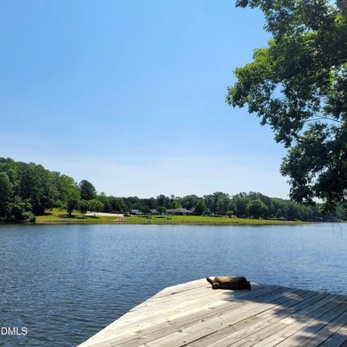 Waterfront home in beautiful Lake Royale with private dock on River Golf and Country Club at Lake Royale in North Carolina - for sale on GolfHomes.com, golf home, golf lot