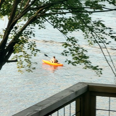 Waterfront home in beautiful Lake Royale with private dock on River Golf and Country Club at Lake Royale in North Carolina - for sale on GolfHomes.com, golf home, golf lot