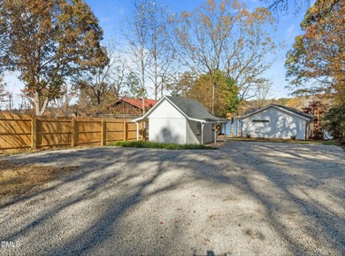 Waterfront home in beautiful Lake Royale with private dock on River Golf and Country Club at Lake Royale in North Carolina - for sale on GolfHomes.com, golf home, golf lot