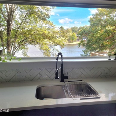 Waterfront home in beautiful Lake Royale with private dock on River Golf and Country Club at Lake Royale in North Carolina - for sale on GolfHomes.com, golf home, golf lot