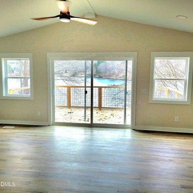 Waterfront home in beautiful Lake Royale with private dock on River Golf and Country Club at Lake Royale in North Carolina - for sale on GolfHomes.com, golf home, golf lot