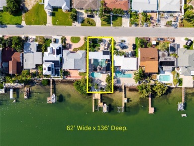 Secluded within the exclusive Boca Ciega Isle neighborhood, this on Isla Del Sol Yacht and Country Club in Florida - for sale on GolfHomes.com, golf home, golf lot
