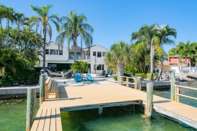Secluded within the exclusive Boca Ciega Isle neighborhood, this on Isla Del Sol Yacht and Country Club in Florida - for sale on GolfHomes.com, golf home, golf lot