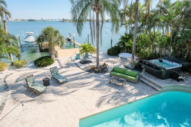 Secluded within the exclusive Boca Ciega Isle neighborhood, this on Isla Del Sol Yacht and Country Club in Florida - for sale on GolfHomes.com, golf home, golf lot