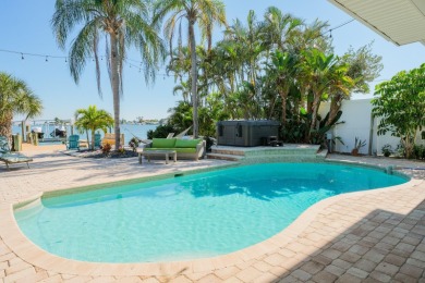 Secluded within the exclusive Boca Ciega Isle neighborhood, this on Isla Del Sol Yacht and Country Club in Florida - for sale on GolfHomes.com, golf home, golf lot