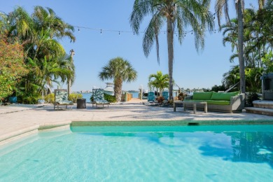 Secluded within the exclusive Boca Ciega Isle neighborhood, this on Isla Del Sol Yacht and Country Club in Florida - for sale on GolfHomes.com, golf home, golf lot