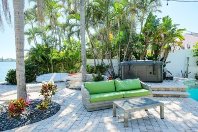 Secluded within the exclusive Boca Ciega Isle neighborhood, this on Isla Del Sol Yacht and Country Club in Florida - for sale on GolfHomes.com, golf home, golf lot