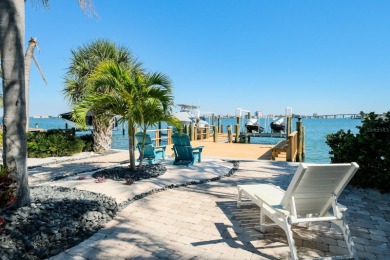 Secluded within the exclusive Boca Ciega Isle neighborhood, this on Isla Del Sol Yacht and Country Club in Florida - for sale on GolfHomes.com, golf home, golf lot