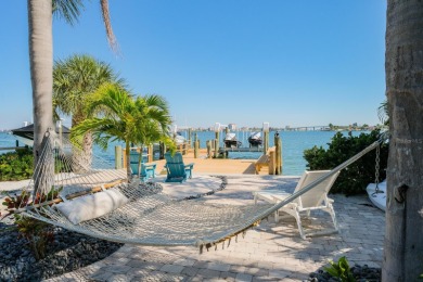 Secluded within the exclusive Boca Ciega Isle neighborhood, this on Isla Del Sol Yacht and Country Club in Florida - for sale on GolfHomes.com, golf home, golf lot