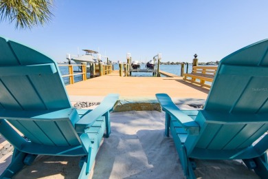 Secluded within the exclusive Boca Ciega Isle neighborhood, this on Isla Del Sol Yacht and Country Club in Florida - for sale on GolfHomes.com, golf home, golf lot