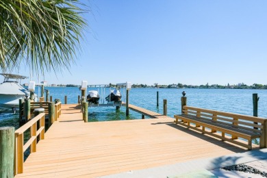 Secluded within the exclusive Boca Ciega Isle neighborhood, this on Isla Del Sol Yacht and Country Club in Florida - for sale on GolfHomes.com, golf home, golf lot