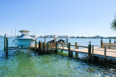 Secluded within the exclusive Boca Ciega Isle neighborhood, this on Isla Del Sol Yacht and Country Club in Florida - for sale on GolfHomes.com, golf home, golf lot