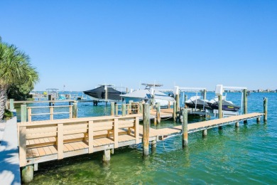 Secluded within the exclusive Boca Ciega Isle neighborhood, this on Isla Del Sol Yacht and Country Club in Florida - for sale on GolfHomes.com, golf home, golf lot