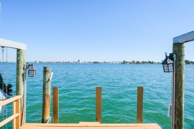 Secluded within the exclusive Boca Ciega Isle neighborhood, this on Isla Del Sol Yacht and Country Club in Florida - for sale on GolfHomes.com, golf home, golf lot