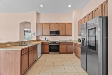 Discover your ideal Lakefront Pool Home at the end of a quiet on Oaks National Golf Course in Florida - for sale on GolfHomes.com, golf home, golf lot