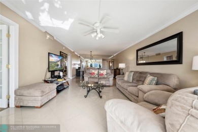 Enjoy golf views from a private screened patio in this updated on Palm-Aire Country Club and Resort - The Oaks in Florida - for sale on GolfHomes.com, golf home, golf lot