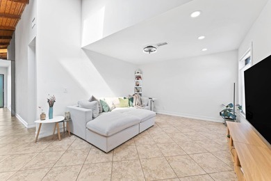 Welcome to this beautifully maintained 3-bedroom, 2-bathroom on Woodmont Country Club in Florida - for sale on GolfHomes.com, golf home, golf lot