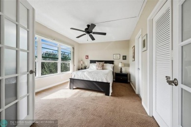 Enjoy golf views from a private screened patio in this updated on Palm-Aire Country Club and Resort - The Oaks in Florida - for sale on GolfHomes.com, golf home, golf lot