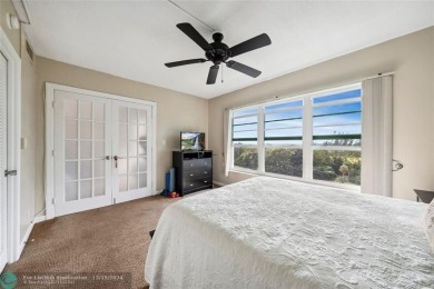 Enjoy golf views from a private screened patio in this updated on Palm-Aire Country Club and Resort - The Oaks in Florida - for sale on GolfHomes.com, golf home, golf lot