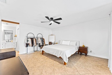 Welcome to this beautifully maintained 3-bedroom, 2-bathroom on Woodmont Country Club in Florida - for sale on GolfHomes.com, golf home, golf lot