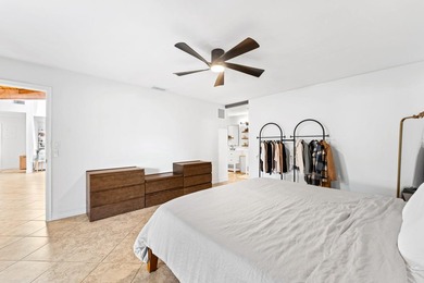 Welcome to this beautifully maintained 3-bedroom, 2-bathroom on Woodmont Country Club in Florida - for sale on GolfHomes.com, golf home, golf lot