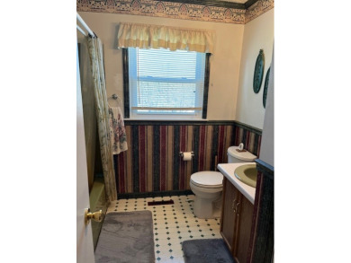 This charming 2-bedroom, 1-bathroom home with an attached garage on Holston Hills Country Club in Virginia - for sale on GolfHomes.com, golf home, golf lot