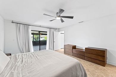 Welcome to this beautifully maintained 3-bedroom, 2-bathroom on Woodmont Country Club in Florida - for sale on GolfHomes.com, golf home, golf lot