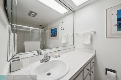 Enjoy golf views from a private screened patio in this updated on Palm-Aire Country Club and Resort - The Oaks in Florida - for sale on GolfHomes.com, golf home, golf lot