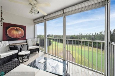 Enjoy golf views from a private screened patio in this updated on Palm-Aire Country Club and Resort - The Oaks in Florida - for sale on GolfHomes.com, golf home, golf lot