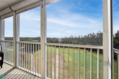 Enjoy golf views from a private screened patio in this updated on Palm-Aire Country Club and Resort - The Oaks in Florida - for sale on GolfHomes.com, golf home, golf lot