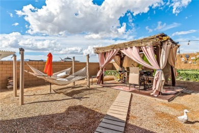 Step into this beautifully maintained custom 2021 home in the on Desert Lakes Golf Course in Arizona - for sale on GolfHomes.com, golf home, golf lot