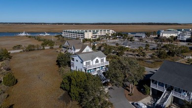 Spacious 2-story home offering panoramic views of the salt marsh on The Plantation Course At Edisto in South Carolina - for sale on GolfHomes.com, golf home, golf lot