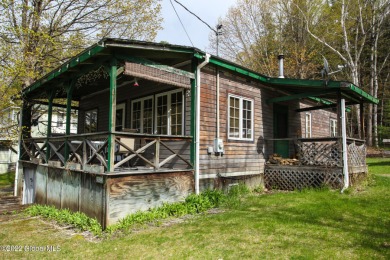 This property is situated on one of Lake Georges northeast on Huletts Golf Course in New York - for sale on GolfHomes.com, golf home, golf lot