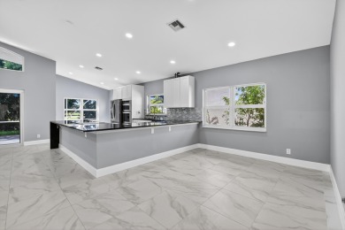 Beautifully renovated 3BR/2BA home in the amazing non-gated on Westchester Golf and Country Club in Florida - for sale on GolfHomes.com, golf home, golf lot