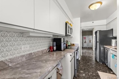 Welcome to this remarkable 2-bedroom, 2-bath residence located on Evergreen Hills Golf Course in Michigan - for sale on GolfHomes.com, golf home, golf lot