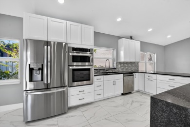 Beautifully renovated 3BR/2BA home in the amazing non-gated on Westchester Golf and Country Club in Florida - for sale on GolfHomes.com, golf home, golf lot