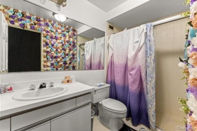 Welcome to this remarkable 2-bedroom, 2-bath residence located on Evergreen Hills Golf Course in Michigan - for sale on GolfHomes.com, golf home, golf lot