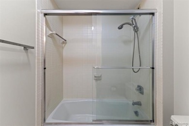 Welcome to this remarkable 2-bedroom, 2-bath residence located on Evergreen Hills Golf Course in Michigan - for sale on GolfHomes.com, golf home, golf lot