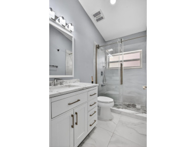 Beautifully renovated 3BR/2BA home in the amazing non-gated on Westchester Golf and Country Club in Florida - for sale on GolfHomes.com, golf home, golf lot