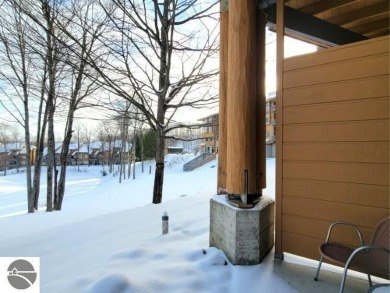 This furnished ground level suite is an ideal spot to enjoy all on Cedar River Golf Course in Michigan - for sale on GolfHomes.com, golf home, golf lot