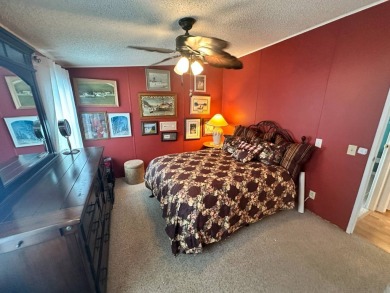 This 2 bedrooms, 2 bathrooms stucco home is being sold furnished on Del Tura Golf and Country Club in Florida - for sale on GolfHomes.com, golf home, golf lot
