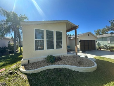 This 2 bedrooms, 2 bathrooms stucco home is being sold furnished on Del Tura Golf and Country Club in Florida - for sale on GolfHomes.com, golf home, golf lot