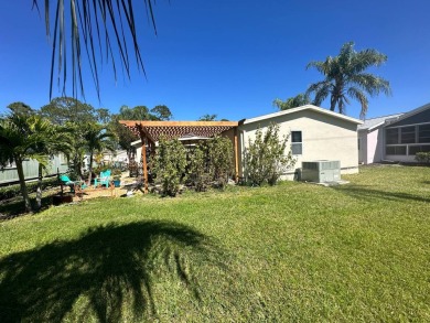 This 2 bedrooms, 2 bathrooms stucco home is being sold furnished on Del Tura Golf and Country Club in Florida - for sale on GolfHomes.com, golf home, golf lot