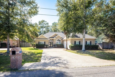Elegant updated home in the highly sought after Diamondhead on Diamondhead Country Club in Mississippi - for sale on GolfHomes.com, golf home, golf lot