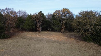 This prime lot on a quiet street in Rock Creek, Gordonville on Rock Creek Golf Club in Texas - for sale on GolfHomes.com, golf home, golf lot