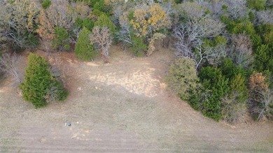 This prime lot on a quiet street in Rock Creek, Gordonville on Rock Creek Golf Club in Texas - for sale on GolfHomes.com, golf home, golf lot