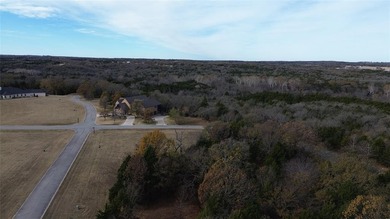 This prime lot on a quiet street in Rock Creek, Gordonville on Rock Creek Golf Club in Texas - for sale on GolfHomes.com, golf home, golf lot