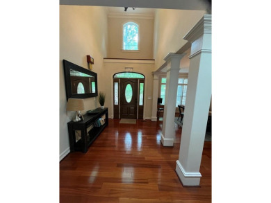 This beautiful brick home is nestled along the 14th hole of on Indian Trace Golf Course in Georgia - for sale on GolfHomes.com, golf home, golf lot